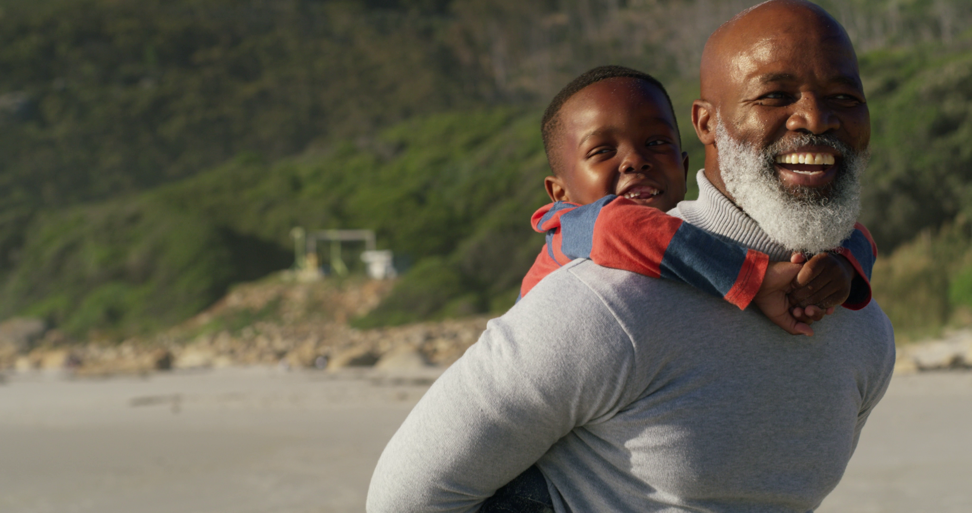 Grandfather giving his grandson a piggyback ride